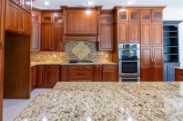 9159 Highland Ridge Way, Tampa, FL 33647 - kitchen with light stone counters, light tile patterned flooring, visible vents, decorative backsplash, and stainless steel appliances