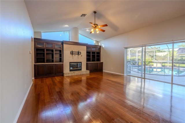 9159 Highland Ridge Way, Tampa, FL 33647 - unfurnished living room with wood-type flooring, baseboards, a ceiling fan, and visible vents