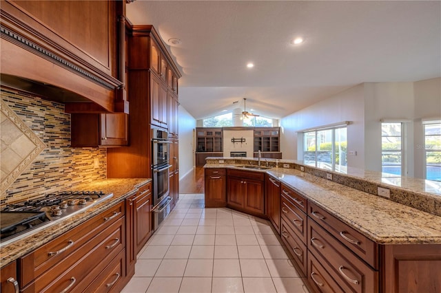 9159 Highland Ridge Way, Tampa, FL 33647 - kitchen with tasteful backsplash, a ceiling fan, a sink, lofted ceiling, and stainless steel appliances