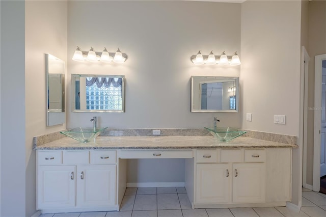 9159 Highland Ridge Way, Tampa, FL 33647 - bathroom with tile patterned floors, double vanity, and a sink
