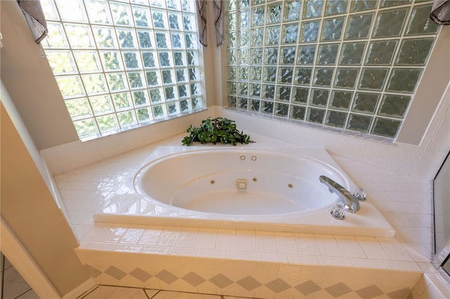 9159 Highland Ridge Way, Tampa, FL 33647 - bathroom featuring tile patterned floors and a tub with jets