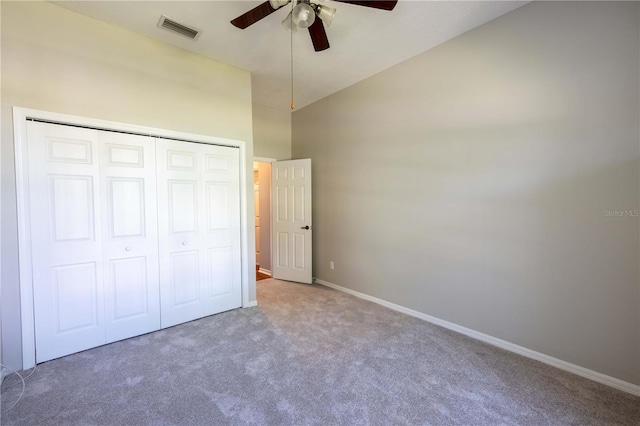 9159 Highland Ridge Way, Tampa, FL 33647 - unfurnished bedroom with a closet, baseboards, carpet flooring, a high ceiling, and visible vents
