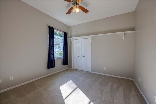 9159 Highland Ridge Way, Tampa, FL 33647 - unfurnished bedroom with a closet, ceiling fan, baseboards, and carpet