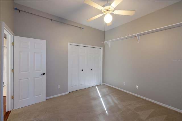 9159 Highland Ridge Way, Tampa, FL 33647 - unfurnished bedroom with a closet, baseboards, a ceiling fan, and carpet floors