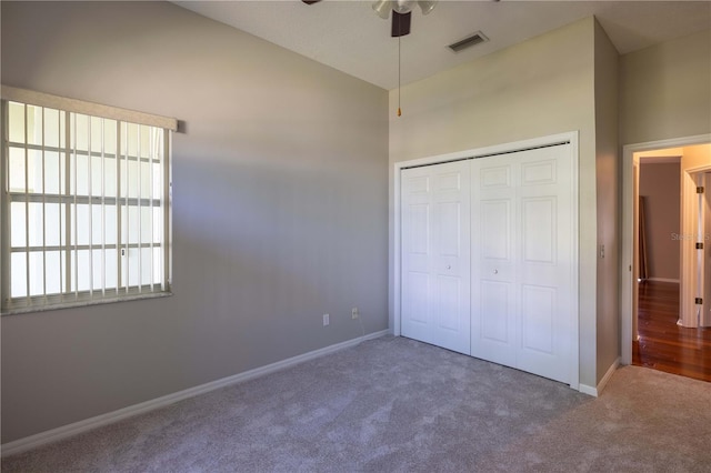 9159 Highland Ridge Way, Tampa, FL 33647 - unfurnished bedroom featuring a closet, baseboards, a ceiling fan, carpet floors, and visible vents