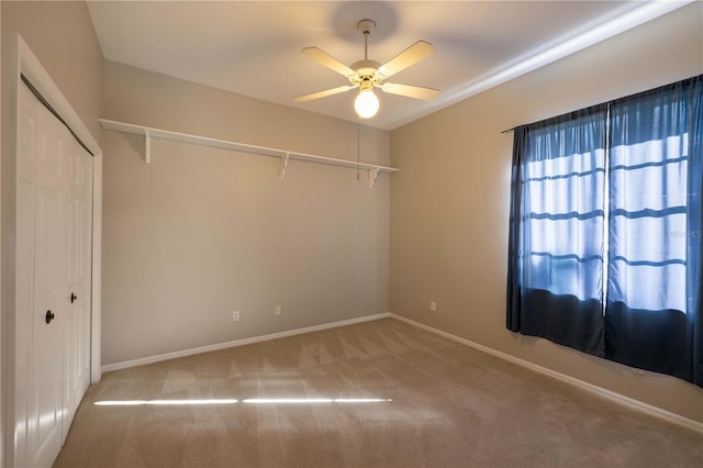 9159 Highland Ridge Way, Tampa, FL 33647 - unfurnished room with baseboards, a ceiling fan, and carpet flooring