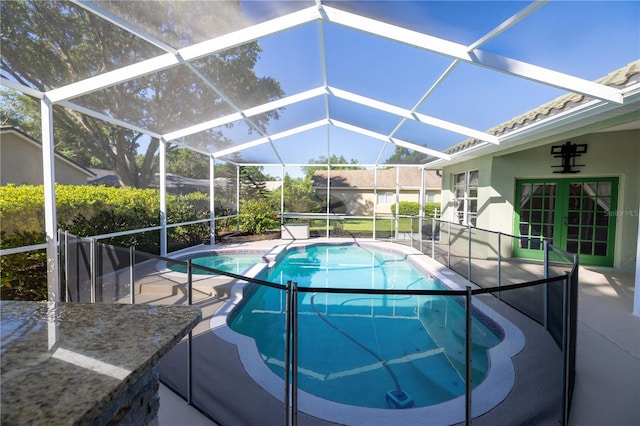9159 Highland Ridge Way, Tampa, FL 33647 - outdoor pool with a patio, french doors, and glass enclosure
