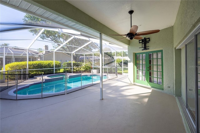 9159 Highland Ridge Way, Tampa, FL 33647 - view of pool with ceiling fan, a pool with connected hot tub, glass enclosure, a patio, and french doors