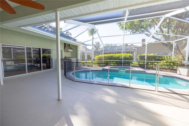 9159 Highland Ridge Way, Tampa, FL 33647 - view of pool featuring a patio, a pool with connected hot tub, and glass enclosure