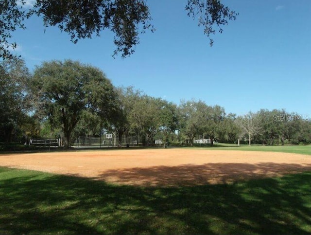 9159 Highland Ridge Way, Tampa, FL 33647 - view of community featuring volleyball court and a lawn