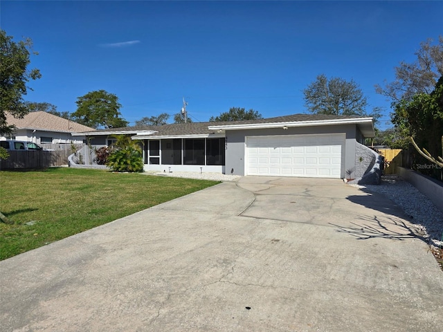 single story home with a sunroom, fence, driveway, and a garage