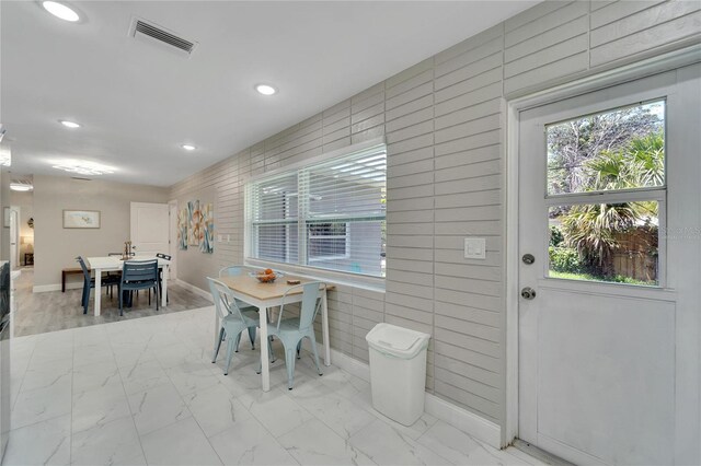 dining space with recessed lighting, visible vents, marble finish floor, and baseboards