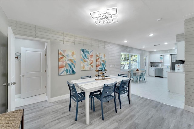dining area with baseboards, light wood-style floors, and recessed lighting