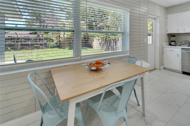 dining room featuring marble finish floor