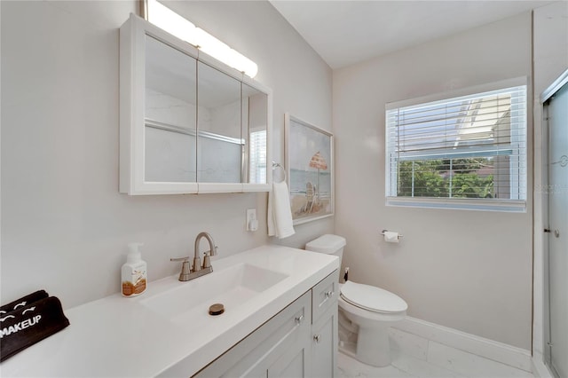 full bathroom with marble finish floor, toilet, vanity, and plenty of natural light