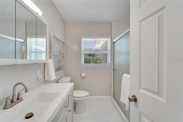 full bath with a shower stall, vanity, marble finish floor, baseboards, and toilet