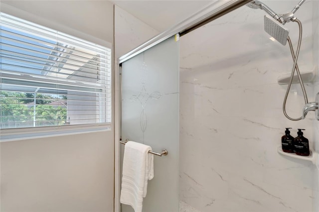 full bathroom with a marble finish shower