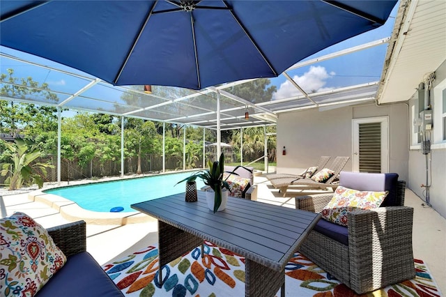 view of pool featuring a fenced in pool, glass enclosure, and a patio