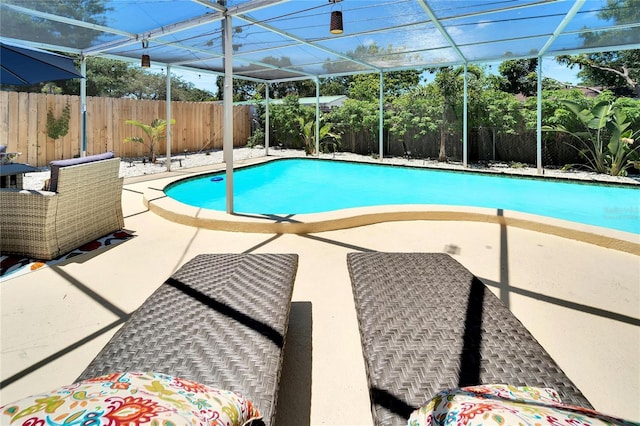 view of swimming pool featuring a fenced in pool, a patio, and a fenced backyard