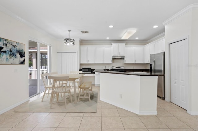 20123 Bay Cedar Ave, Tampa, FL 33647 - kitchen featuring under cabinet range hood, visible vents, crown molding, appliances with stainless steel finishes, and white cabinetry