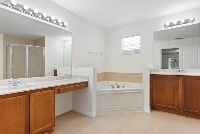 20123 Bay Cedar Ave, Tampa, FL 33647 - bathroom with a bath, a sink, two vanities, tile patterned flooring, and a shower stall