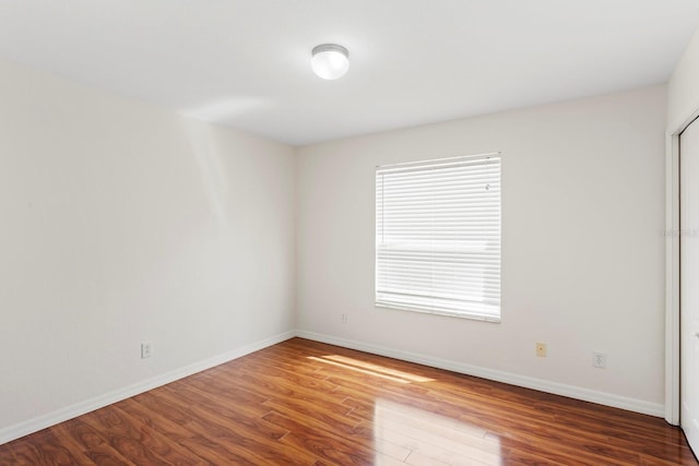20123 Bay Cedar Ave, Tampa, FL 33647 - empty room featuring baseboards and wood finished floors