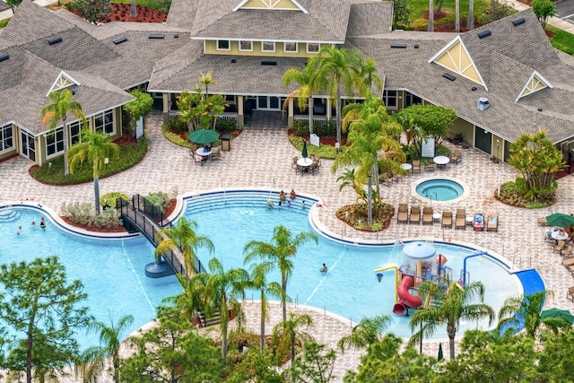 20123 Bay Cedar Ave, Tampa, FL 33647 - community pool featuring a community hot tub and a patio area