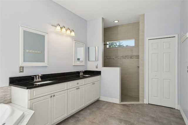 6518 Paw Pl, Land O Lakes, FL 34639 - full bath with walk in shower, double vanity, a sink, and baseboards