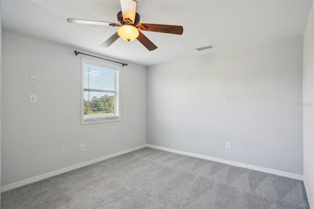 6518 Paw Pl, Land O Lakes, FL 34639 - carpeted empty room with a ceiling fan, visible vents, and baseboards
