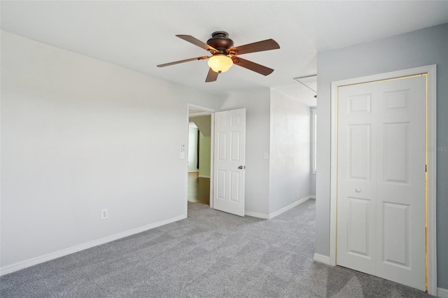 6518 Paw Pl, Land O Lakes, FL 34639 - unfurnished bedroom with baseboards, a ceiling fan, and carpet floors