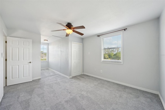 6518 Paw Pl, Land O Lakes, FL 34639 - unfurnished bedroom with ceiling fan, carpet, and baseboards