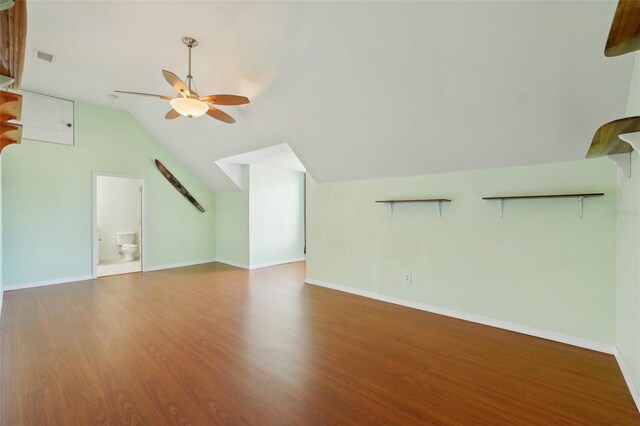 6518 Paw Pl, Land O Lakes, FL 34639 - additional living space with ceiling fan, wood finished floors, visible vents, baseboards, and lofted ceiling