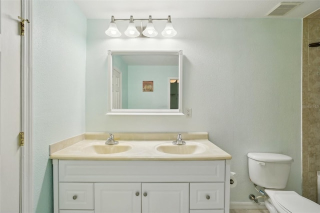 6518 Paw Pl, Land O Lakes, FL 34639 - full bathroom with visible vents, toilet, double vanity, and a sink