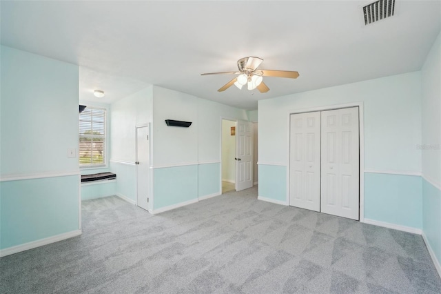 6518 Paw Pl, Land O Lakes, FL 34639 - unfurnished bedroom with visible vents, a closet, baseboards, carpet floors, and a ceiling fan