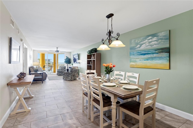 5353 Gulf Blvd Unit B103, St Pete Beach, FL 33706 - tiled dining area with baseboards and ceiling fan
