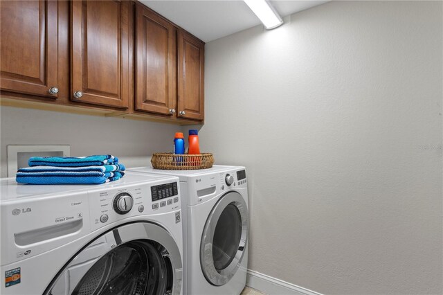 5353 Gulf Blvd Unit B103, St Pete Beach, FL 33706 - laundry room featuring cabinet space, washer and dryer, and baseboards