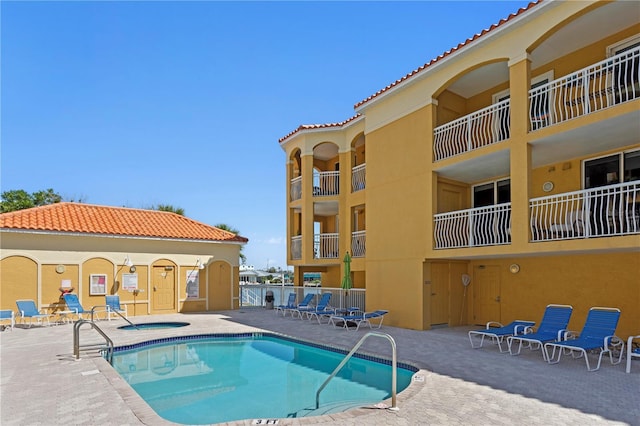 5353 Gulf Blvd Unit B103, St Pete Beach, FL 33706 - community pool featuring a hot tub and a patio area