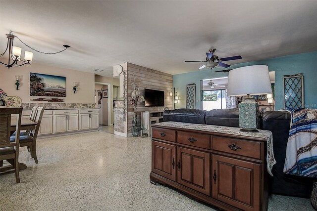 5931 33rd Ave N, Saint Petersburg, FL 33710 - bedroom featuring light speckled floor, visible vents, and ceiling fan with notable chandelier