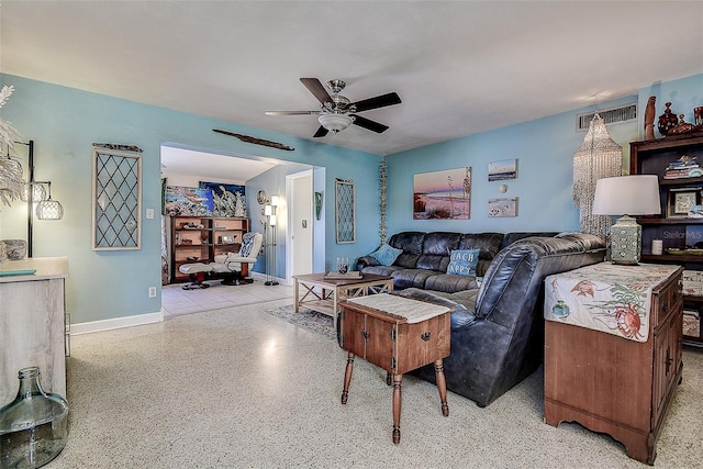 5931 33rd Ave N, Saint Petersburg, FL 33710 - living area with baseboards, visible vents, light speckled floor, and ceiling fan