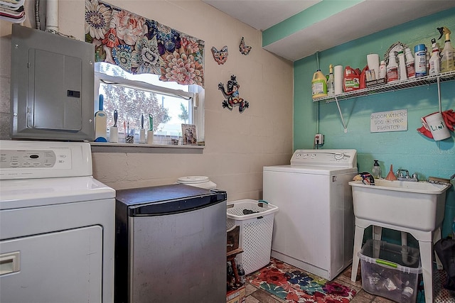 5931 33rd Ave N, Saint Petersburg, FL 33710 - clothes washing area featuring separate washer and dryer, electric panel, a sink, and laundry area