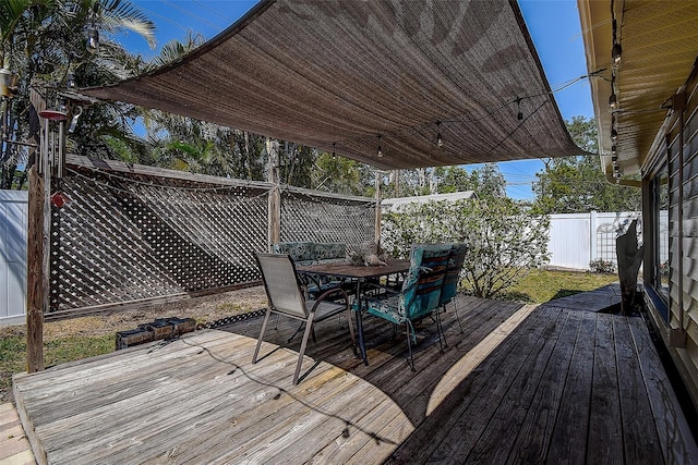 5931 33rd Ave N, Saint Petersburg, FL 33710 - wooden deck with a fenced backyard and outdoor dining space