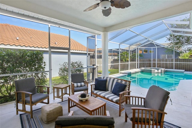 view of swimming pool featuring a fenced backyard, a ceiling fan, a patio, and a pool with connected hot tub