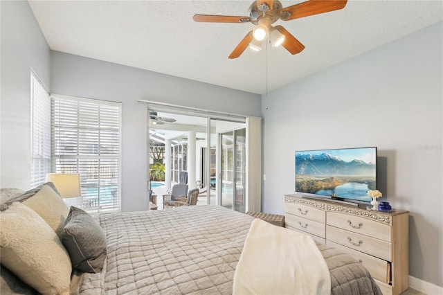 bedroom featuring a ceiling fan and access to outside