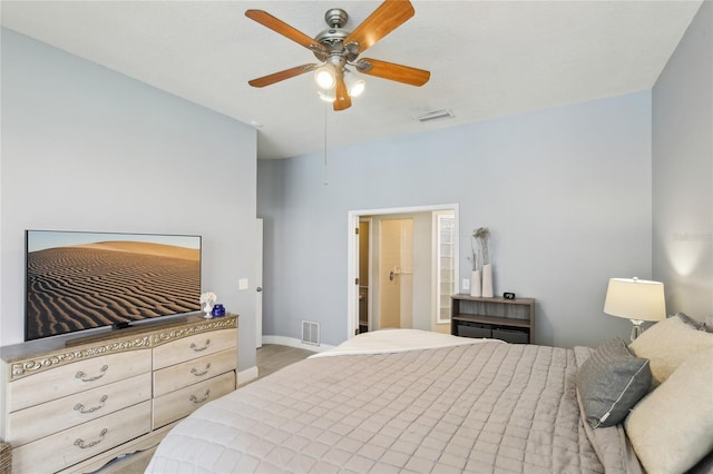 bedroom with baseboards, visible vents, and ceiling fan