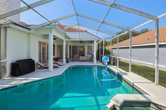 outdoor pool with a ceiling fan, outdoor lounge area, area for grilling, a patio area, and a lanai
