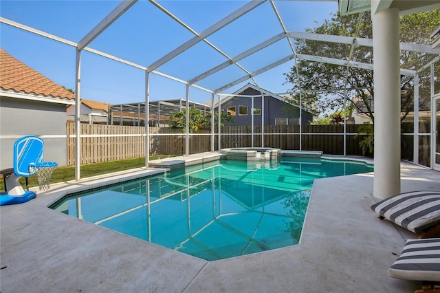 view of pool with a patio area, a fenced backyard, and a pool with connected hot tub