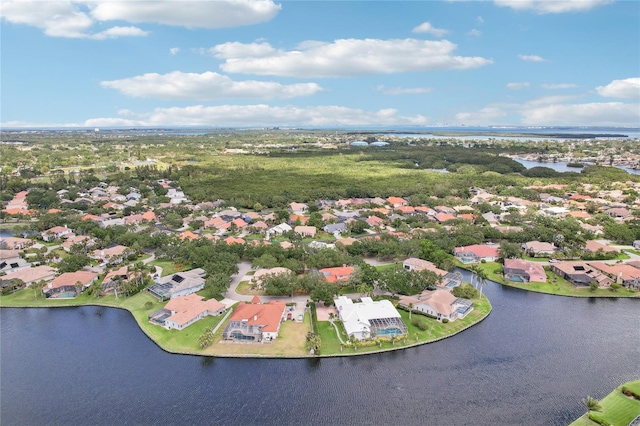 bird's eye view with a residential view and a water view