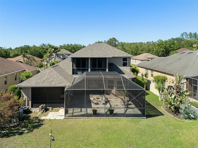 27318 Sora Blvd, Wesley Chapel, FL 33544 - rear view of house featuring stucco siding, a patio area, a yard, a lanai, and roof with shingles
