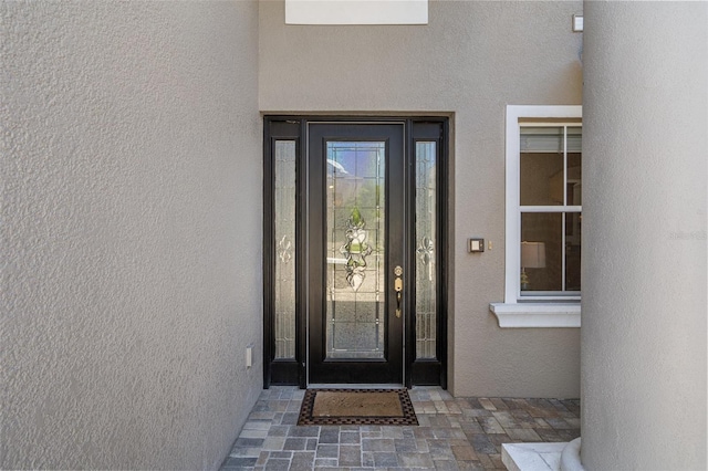 27318 Sora Blvd, Wesley Chapel, FL 33544 - property entrance featuring stucco siding