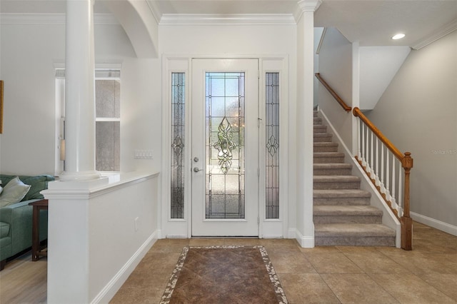 27318 Sora Blvd, Wesley Chapel, FL 33544 - entrance foyer featuring baseboards, ornamental molding, decorative columns, stairway, and recessed lighting